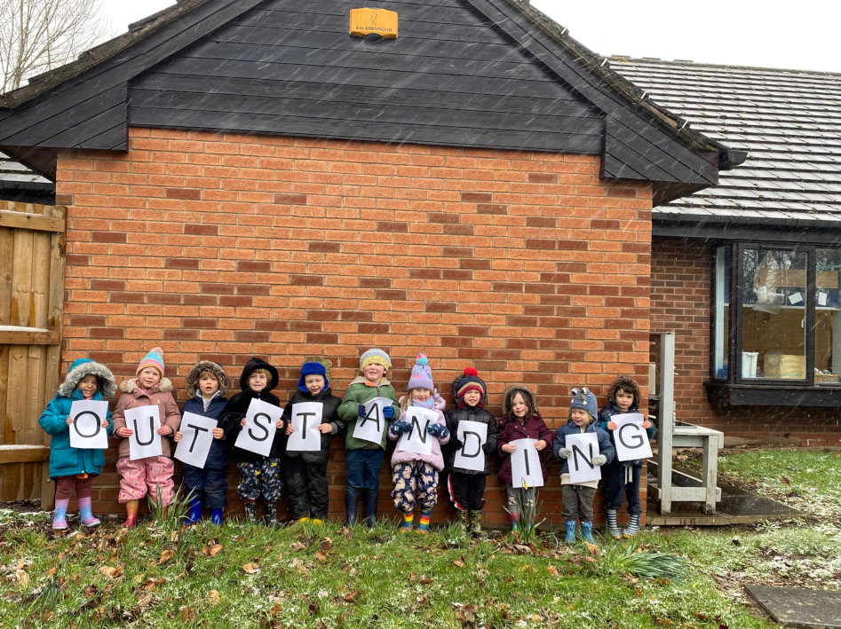 Children at The Oaks join the nursery’s Ofsted success celebrations.