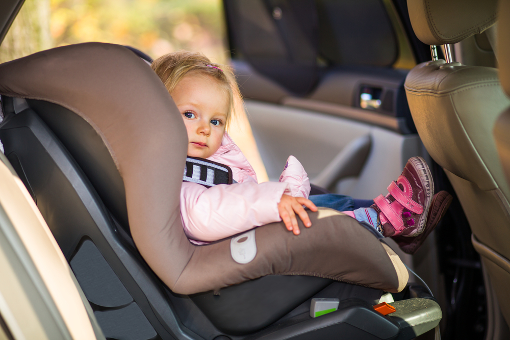 An infant in a baby seat