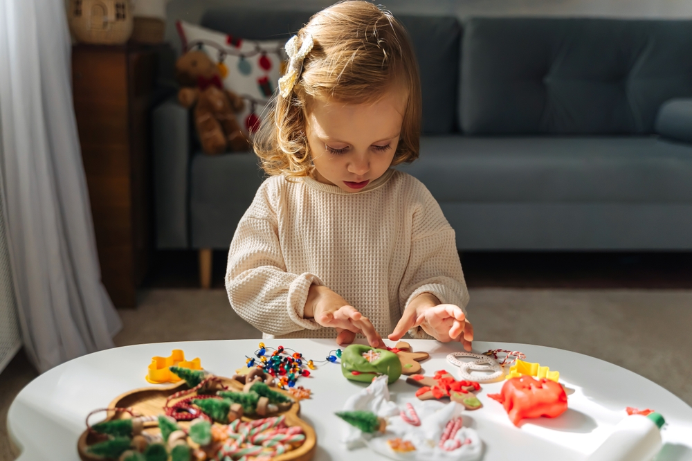 A child playing with play dough