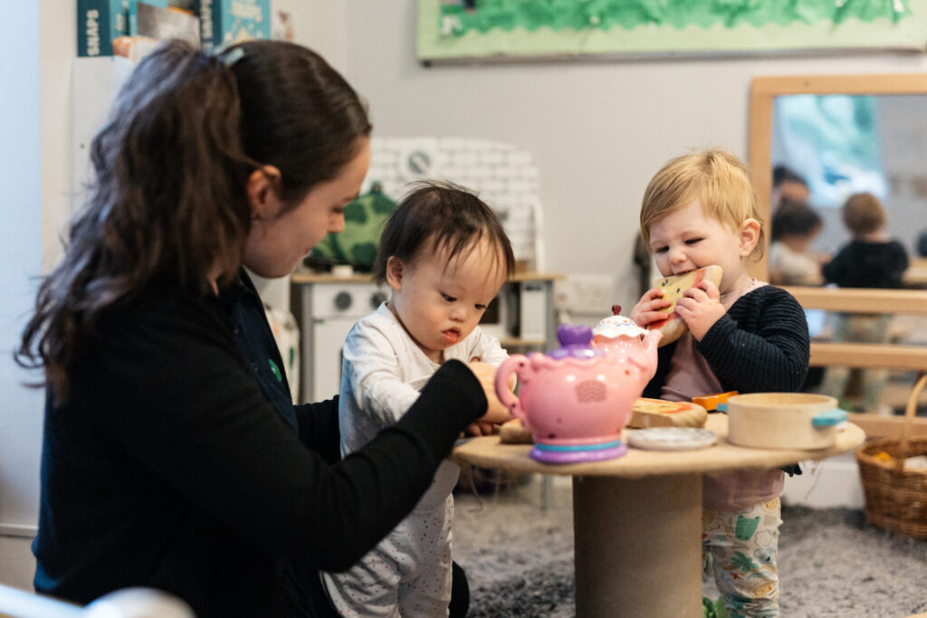 Children playing with staff member